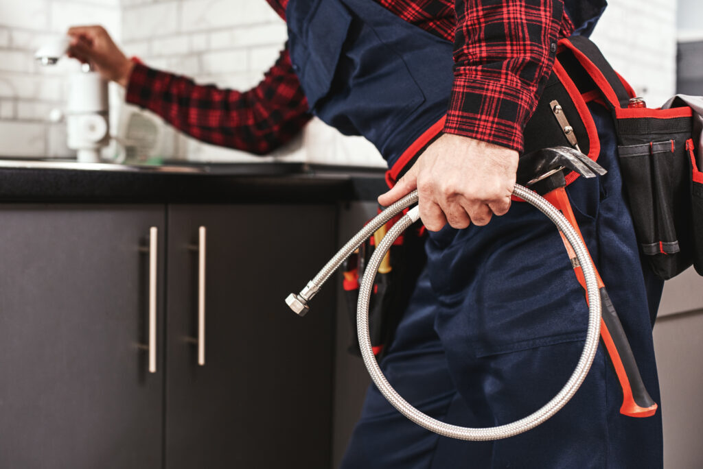 Plumbing foreman inspecting new pipe installation
